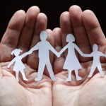 Paper chain family in cupped hands