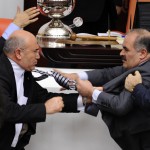 Turkey's ruling AK Party lawmaker Muhittin Aksak and main opposition Republican People's Party lawmaker Mahmut Tanal scuffle during a debate at the parliament in Ankara